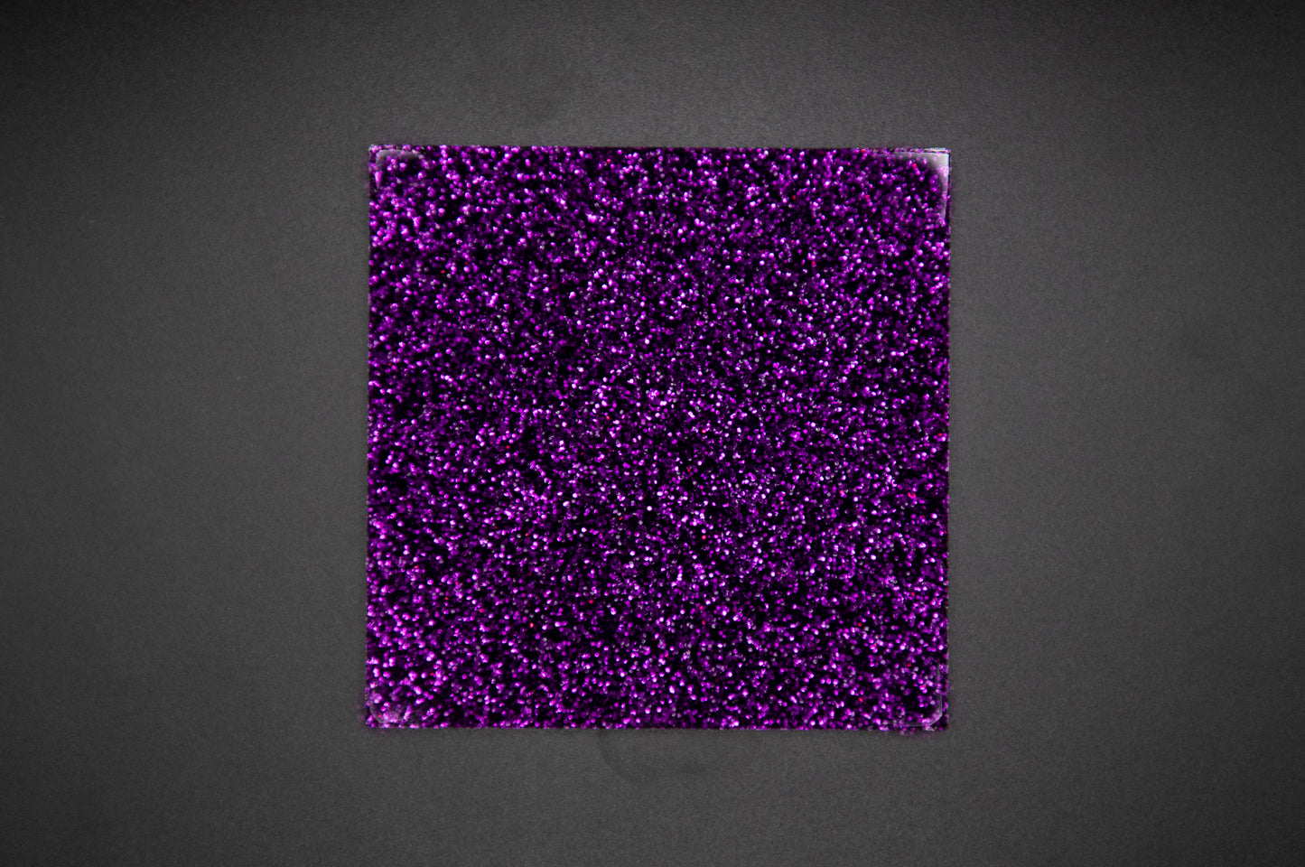Glitter deep purple on black background