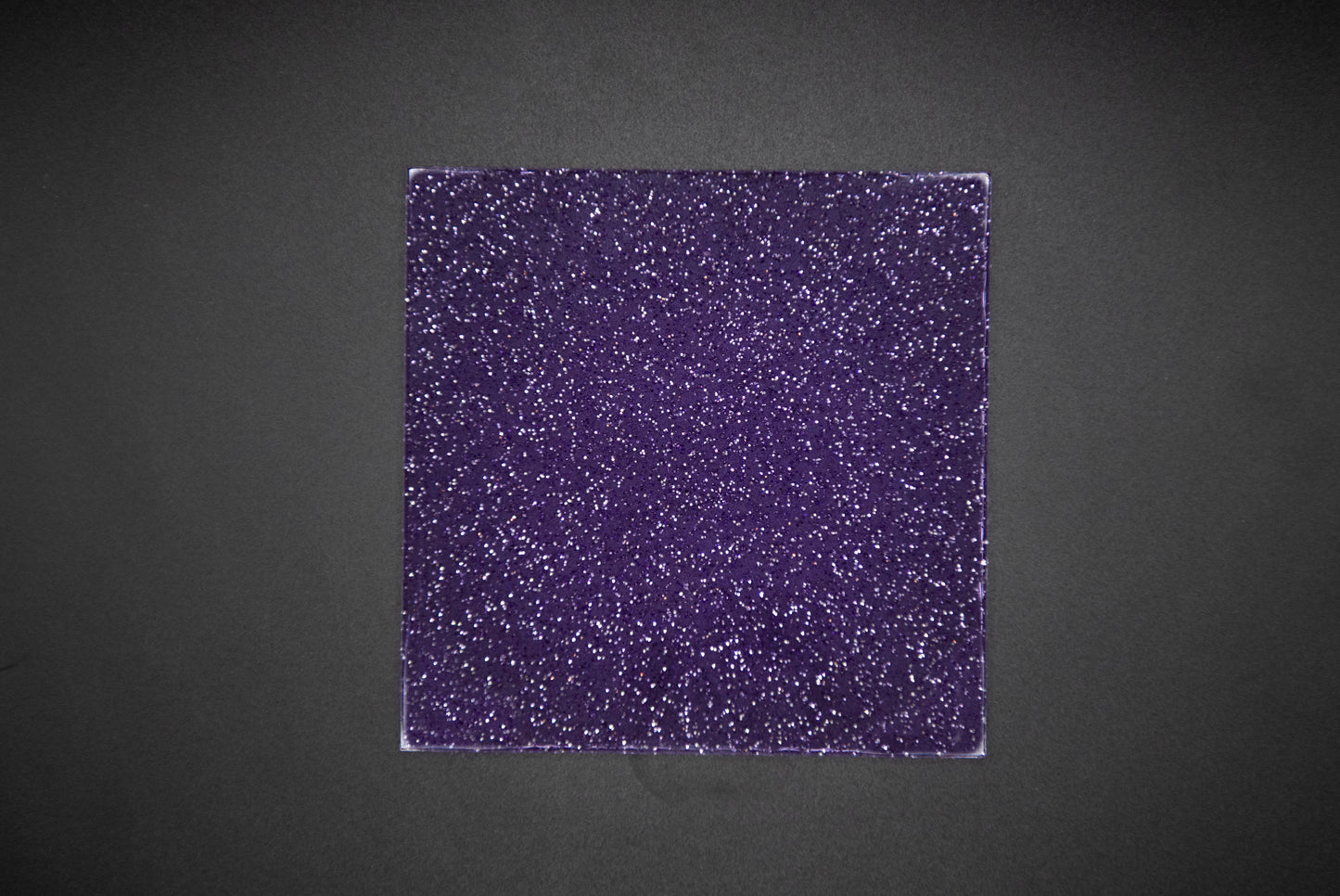 Glitter purple jelly on black background